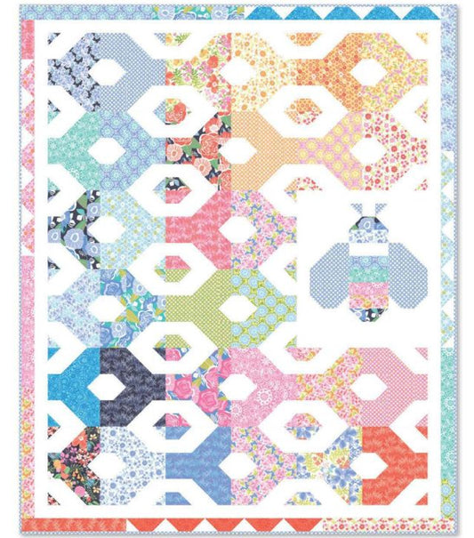 Honey bee hexagon quilt pattern with colorful fabric blocks and whimsical bee motifs
