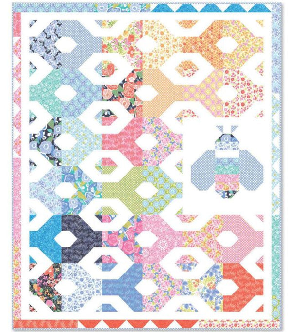 Honey bee hexagon quilt pattern with colorful fabric blocks and whimsical bee motifs
