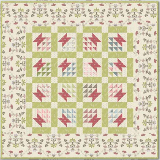 Quilt pattern layout with red, blue, and green blocks on cream background