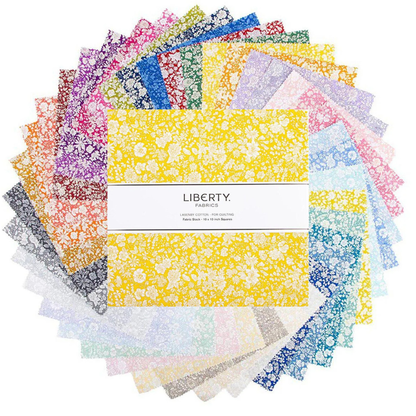 Assorted quilt fabric precut squares bundle in yellow, blue, pink, and purple floral prints