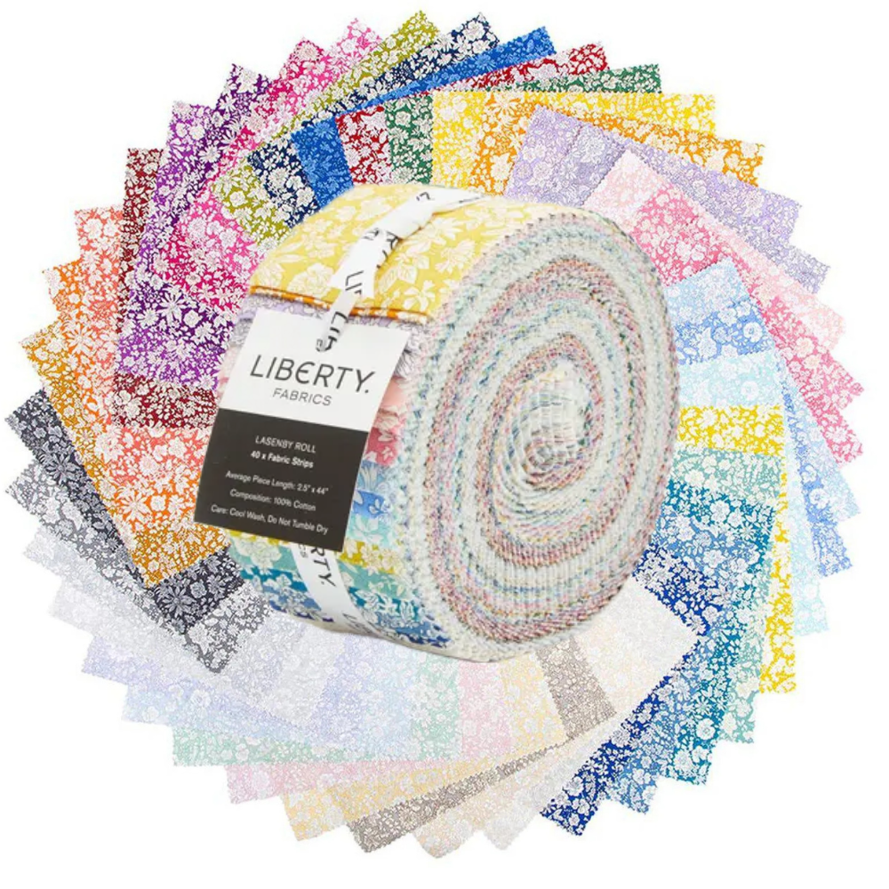 A roll of Liberty Fabrics jellied fabric, featuring a multicolor pastel pattern with yellow, pink, blue, and white tones, wrapped with a black and white paper label.