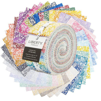 A roll of Liberty Fabrics jellied fabric, featuring a multicolor pastel pattern with yellow, pink, blue, and white tones, wrapped with a black and white paper label.