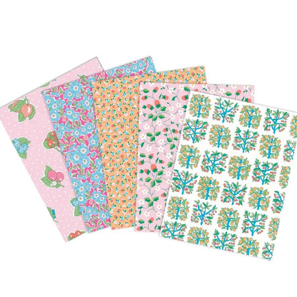 Assorted fat quarter fabric bundle with garden floral, fruit, and vine prints in pink and blue