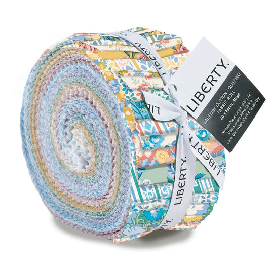 A roll of Liberty brand cotton quilting fabric, featuring a multicolor floral and botanical pattern bundle tied with a white ribbon and black tag.