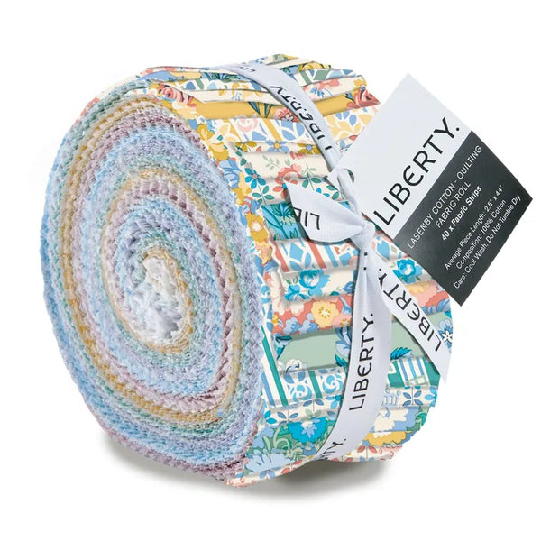 A roll of Liberty brand cotton quilting fabric, featuring a multicolor floral and botanical pattern bundle tied with a white ribbon and black tag.