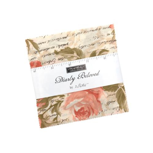 Floral quilt fabric charm pack in clear wrapper with label and roses in cream and blush