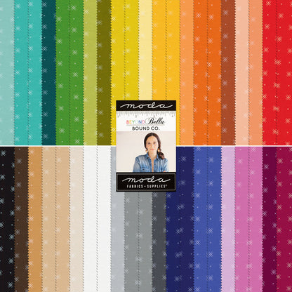 Moda printed fabric assortment with vertical striped patterns and center labels