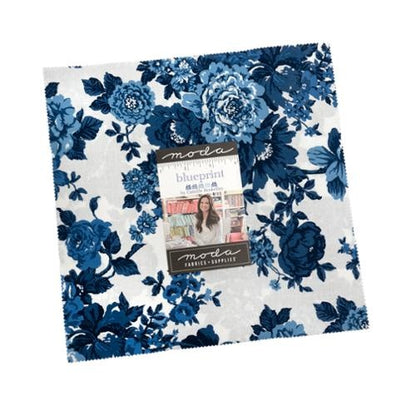 Floral blueprint quilt layer cake fabric squares, blue and navy with white background