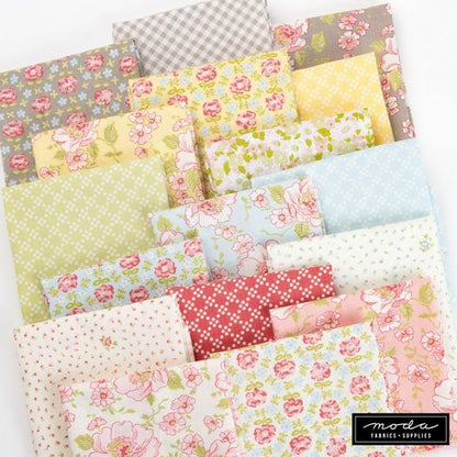 Floral layer cake fabric squares in pastel pink, yellow, blue, and green