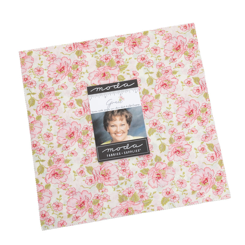 Pink floral quilt fabric square with Moda label and photo on package card