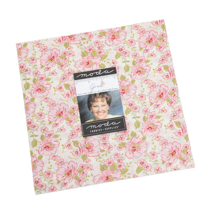 Pink floral quilt fabric square with Moda label and photo on package card