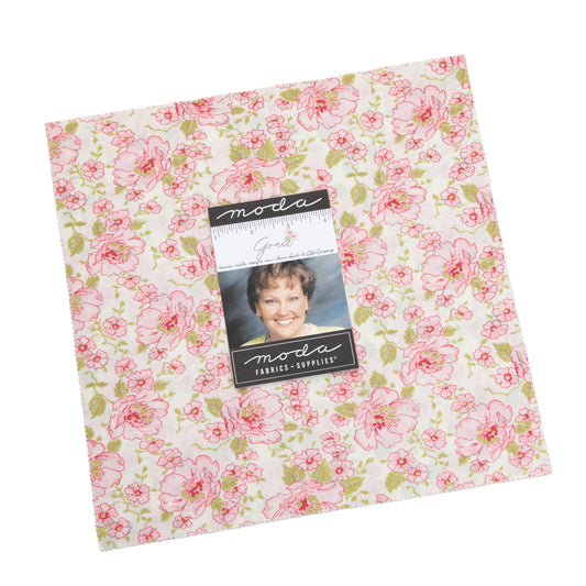 Pink floral quilt fabric square with Moda label and photo on package card