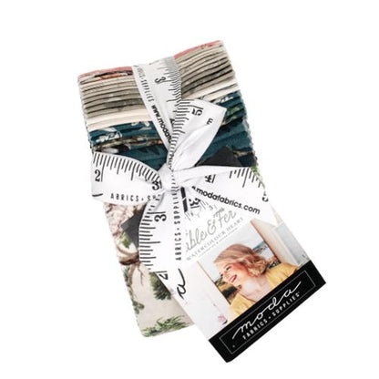 Collection of fabric strips in a jelly roll with a moda ribbon and the Fable & Fern branding.