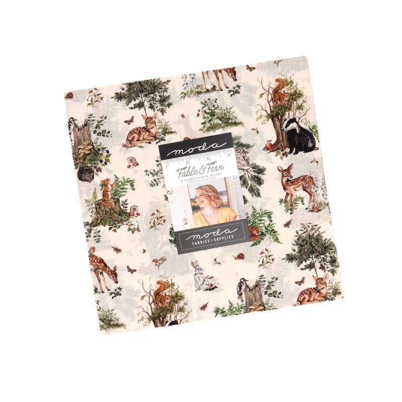 A layer cake featuring a collection of fabric swatches with various patterns and the Fable & Fern and a Moda label branding.