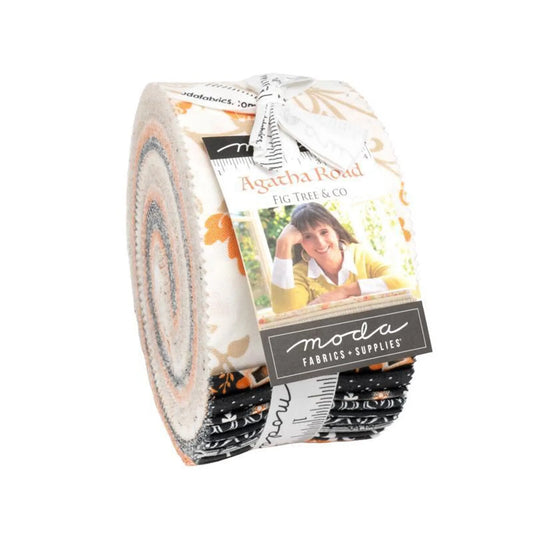 A jelly roll collection of fabric strips with various patterns and colors, featuring the brand 'Agatha Road' and 'Moda' in a country theme.