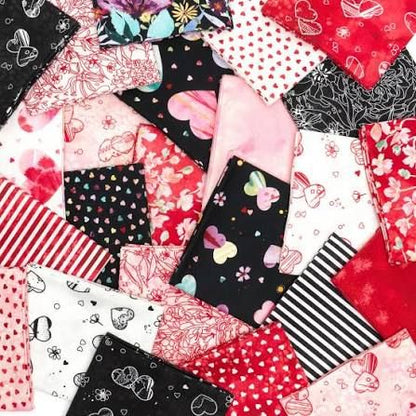 Assorted 5-inch charm squares with hearts, butterflies, florals, stripes, and dark prints