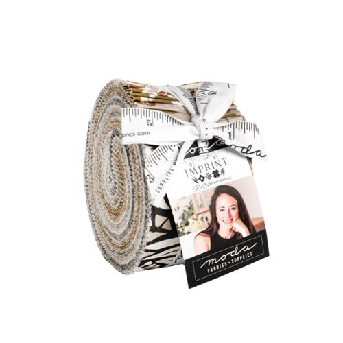 A jelly roll, with a collection of fabric strips with 'Imprint Sewn by Amy Schelle Moda' branding.
