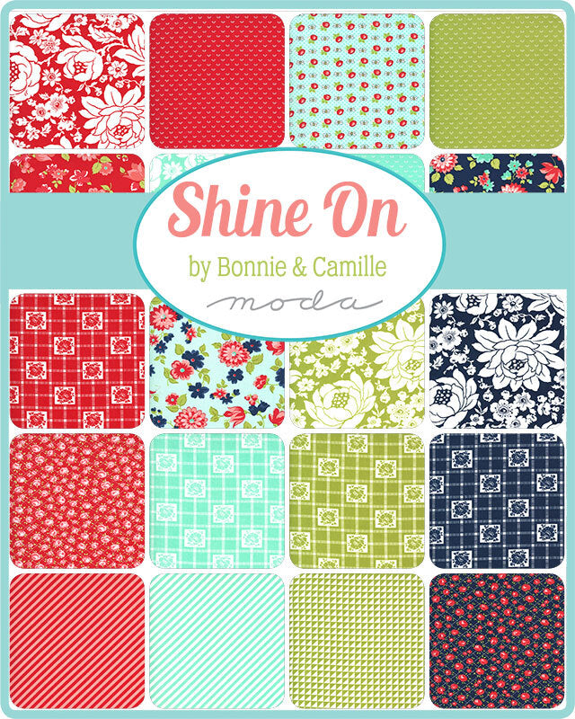 Fabric charm squares assortment with red, green, blue and floral geometric prints