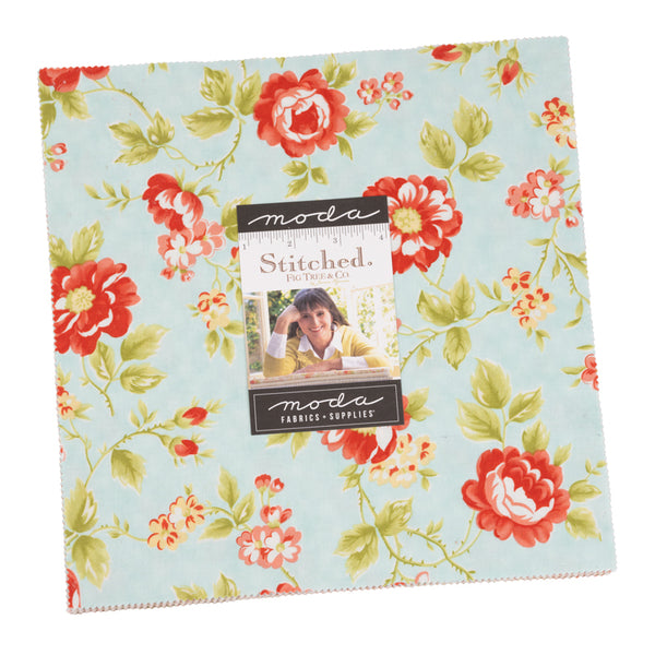 Floral fabric layer cake with red and green rose prints, Moda Stitched label centered