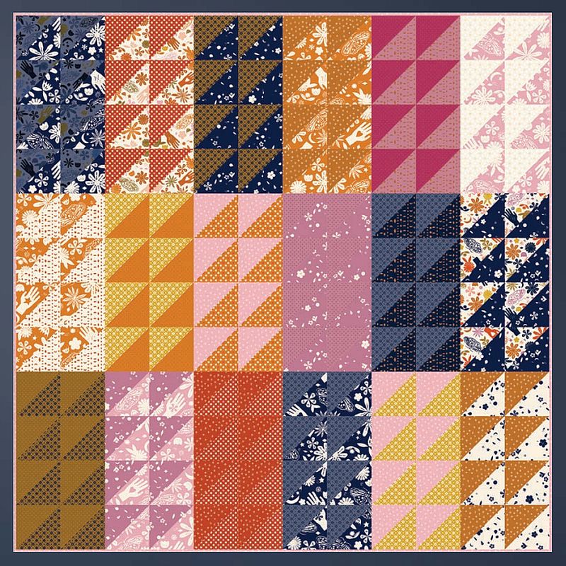 Patchwork quilt pattern layout with navy, orange, pink, and cream fabric blocks