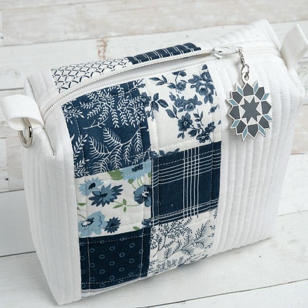 Quilted mini zipper pouch with blue patchwork floral and star charm
