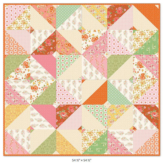 Patchwork quilt top with pastel floral star blocks in pink, orange, green, and yellow