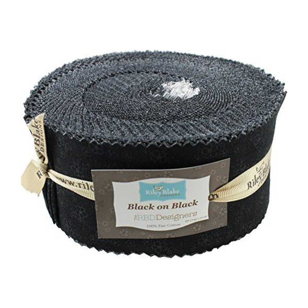 Black quilt fabric roll with label and 2.5-inch tonal floral calico strips