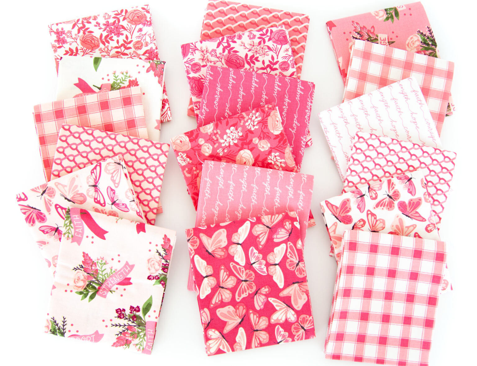 Collection of pink fabric swatches with various patterns on a white background