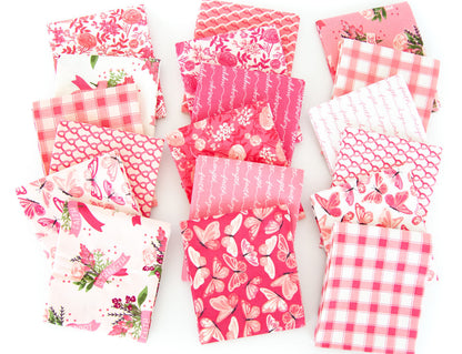 Collection of pink fabric swatches with various patterns on a white background