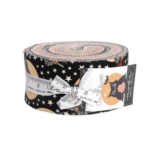 Halloween fabric jelly roll in black, tan, and orange with owl silhouettes and stars