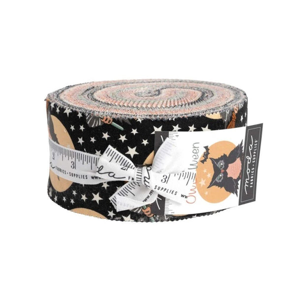 Halloween fabric jelly roll in black, tan, and orange with owl silhouettes and stars