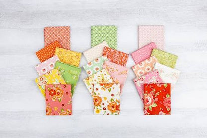 Assorted Peach Cobbler fabric squares showing coordinating peach, cream and floral designs