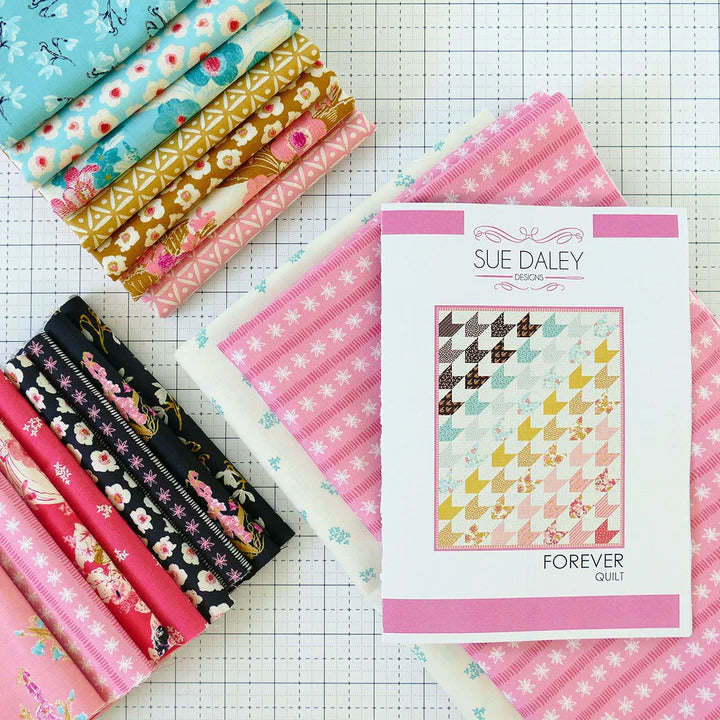 Quilt kit with patterned fabric bundle and Forever quilt instruction packet