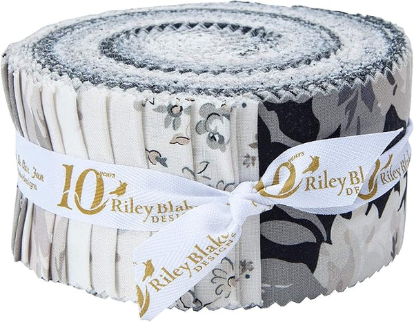 Assorted Serenity Jelly Roll fabric strips showing floral and blender prints