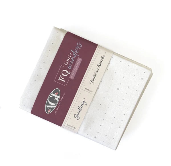 Cotton fat quarter bundle, folded with cream and maroon speckled fabric pieces
