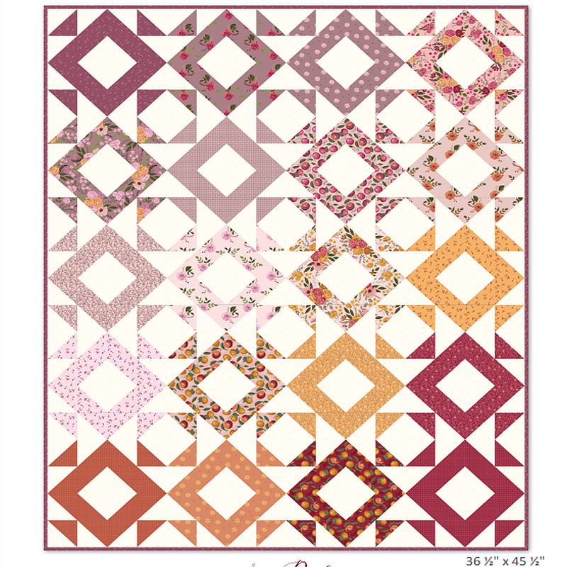 Quilt top pattern in diamond squares with pink, cream, orange and floral prints