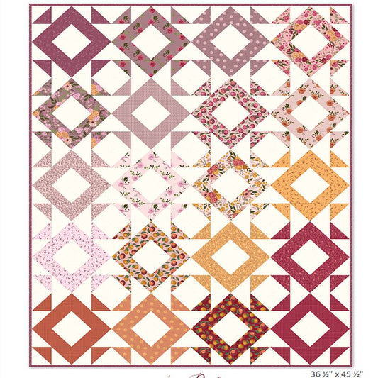 Quilt top pattern in diamond squares with pink, cream, orange and floral prints