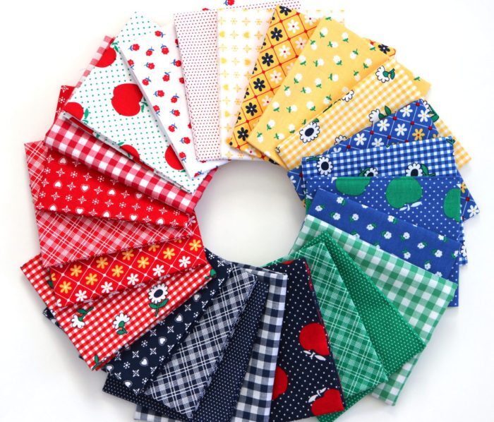 Collection of colorful fabric swatches arranged in a circular pattern on a white background.