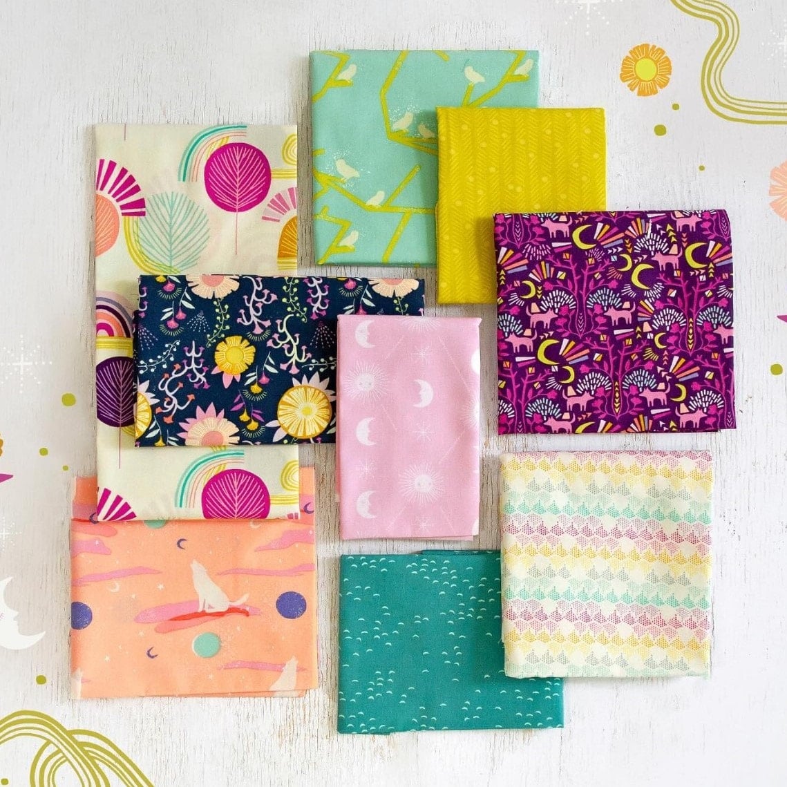 Fat quarter bundle with yoga silhouettes and rainbows in mint, pink, and navy