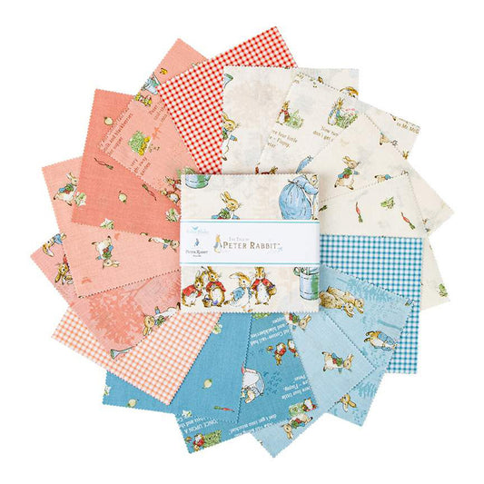 Peter Rabbit fabric charm squares with peach, blue gingham, and bunny floral prints