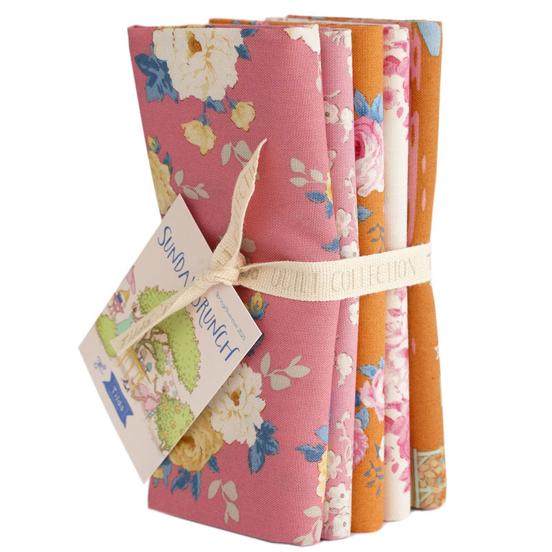 Floral fat quarter fabric bundle in pink, orange, and cream with assorted prints