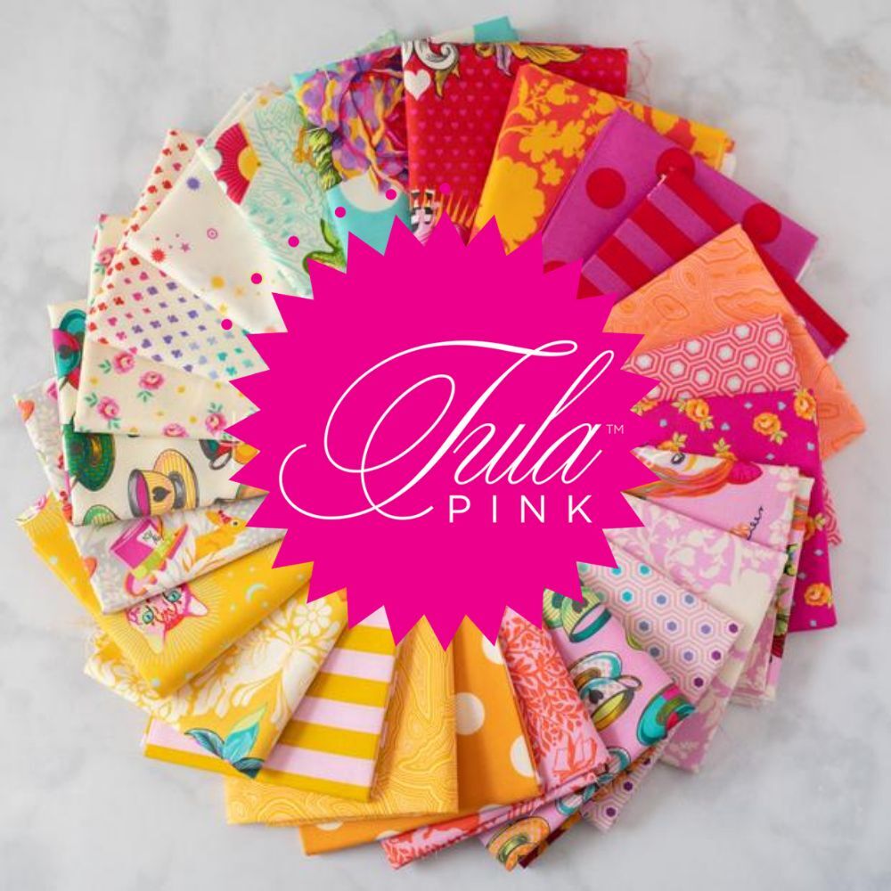 Colorful fabric squares arranged in a circular pattern with Tula Pink logo.