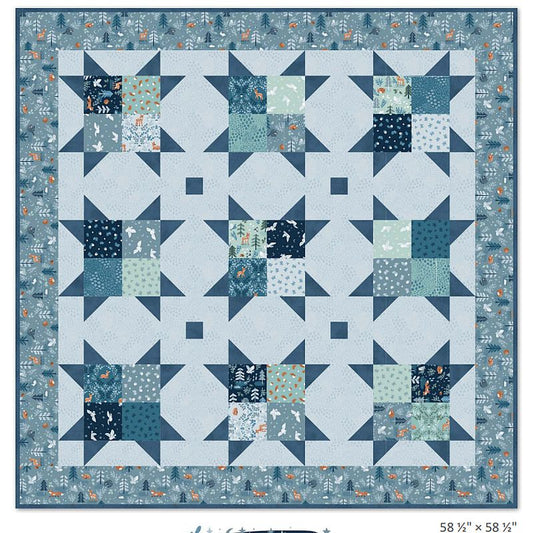 5-inch charm quilt pattern featuring blue and teal patchwork blocks with pine tree prints